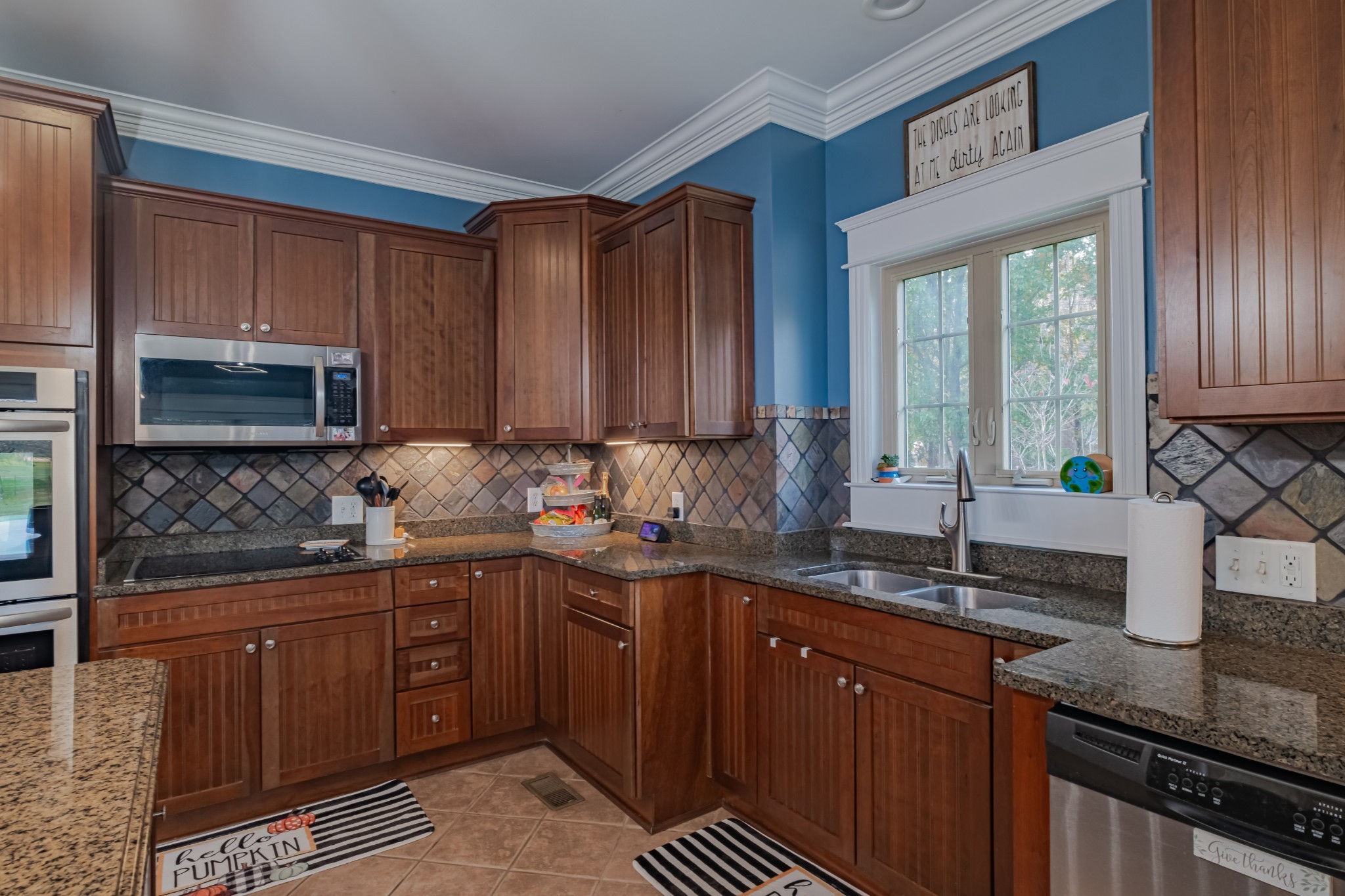 356 Ridgecrest Drive Winchester, TN 37398 - Photo 18 of 73 a kitchen with stainless steel appliances granite countertop a sink stove and cabinets