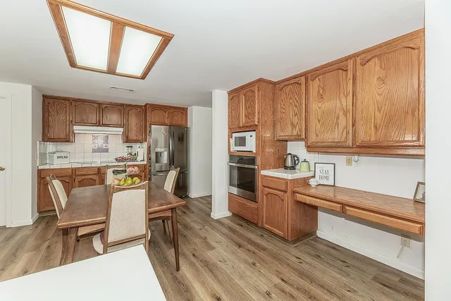 a view of a backyard with sitting area