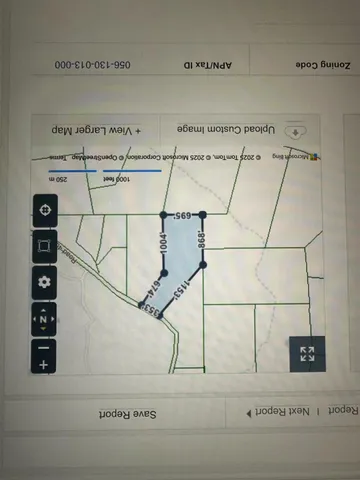 a view of a dining room with furniture and a window