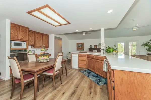a kitchen with granite countertop a sink and a stove