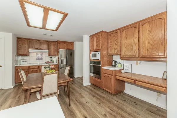 a kitchen with a stove and cabinets
