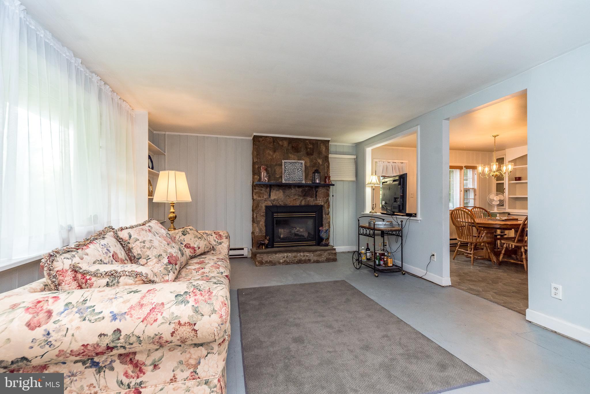 6634 Phillips Mill Road New Hope, PA 18938 - Photo 6 of 35 Living Room w/stone gas fireplace
