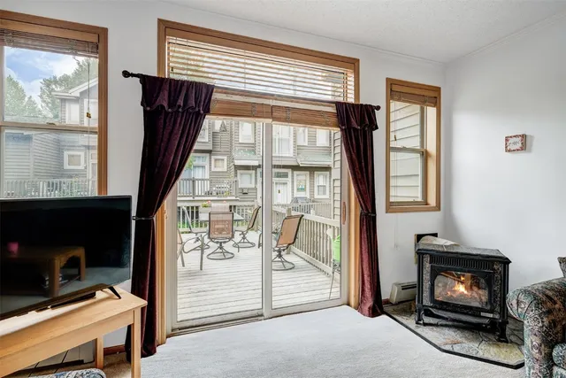 a view of a livingroom with furniture and a fireplace
