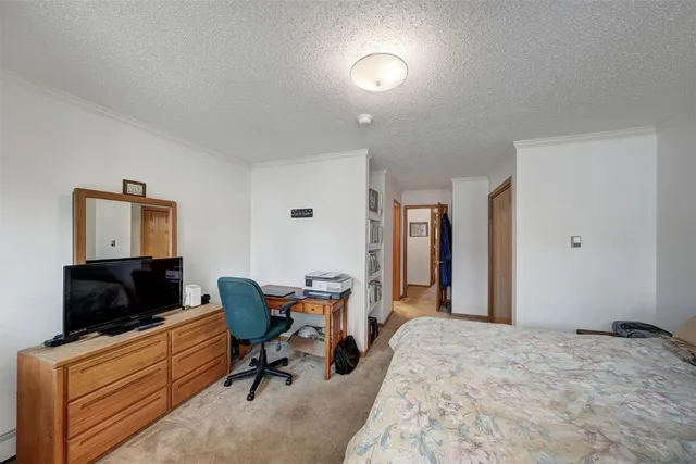 a bedroom with furniture and a bed