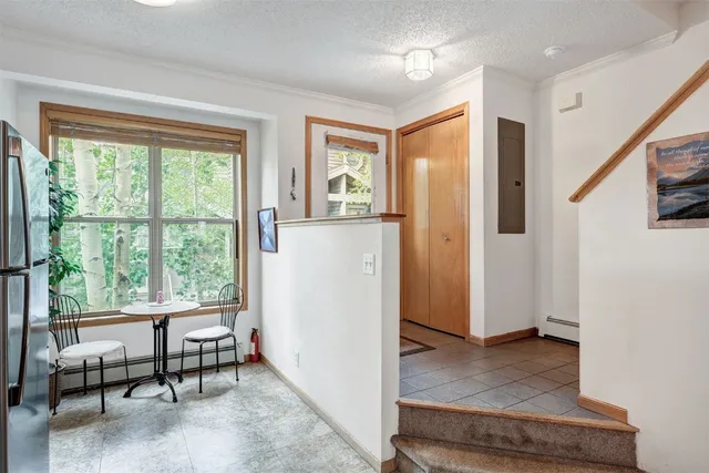 a view of a livingroom with furniture and a window