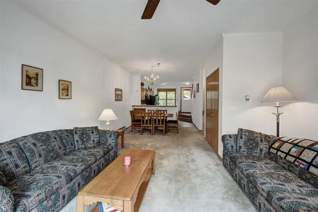 a living room with furniture and a table