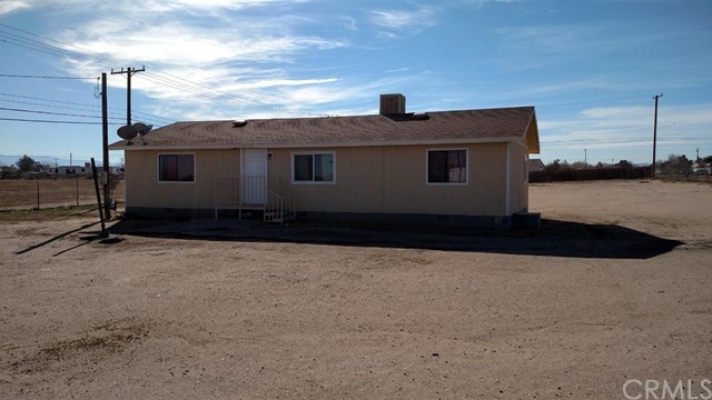 a house view with a backyard space