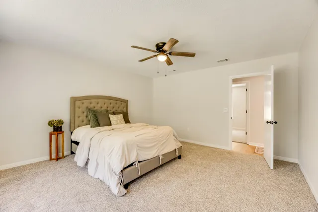 a view of a patio with a table and chairs