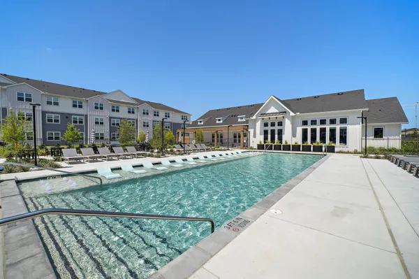 a front view of building with yard