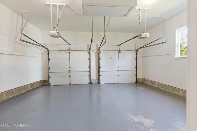 a view of a house with a yard and potted plants