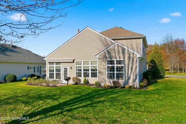 a front view of a house with a large window