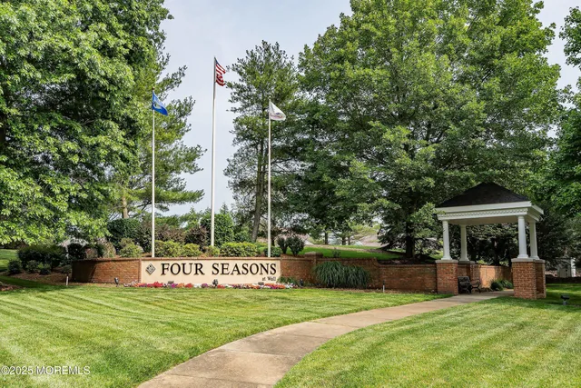 a view of a lake with houses in the back