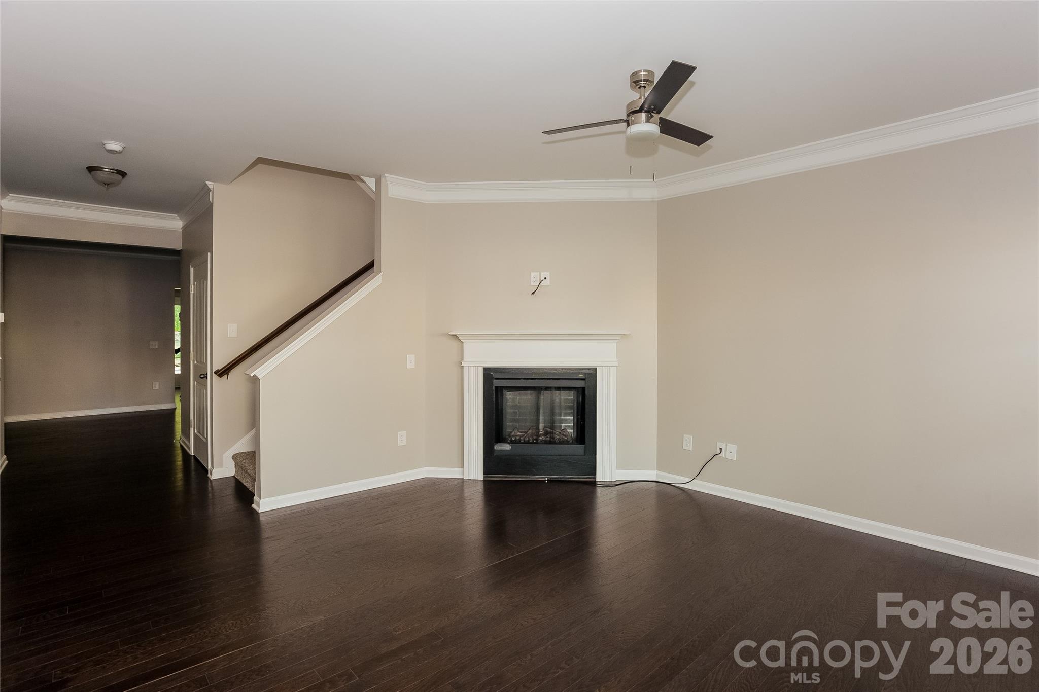 288 Harrison Lane Locust, NC 28097 - Photo 5 of 15 a view of an empty room with wooden floor and a window
