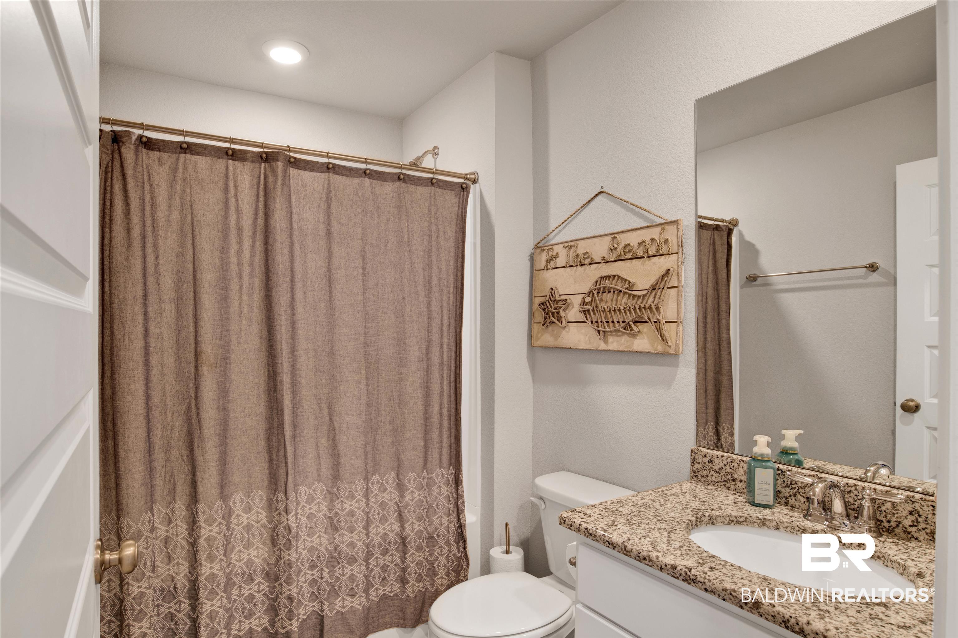 24532 Broken Sound Loop Orange Beach, AL 36561 - Photo 20 of 29 Bathroom featuring toilet and vanity
