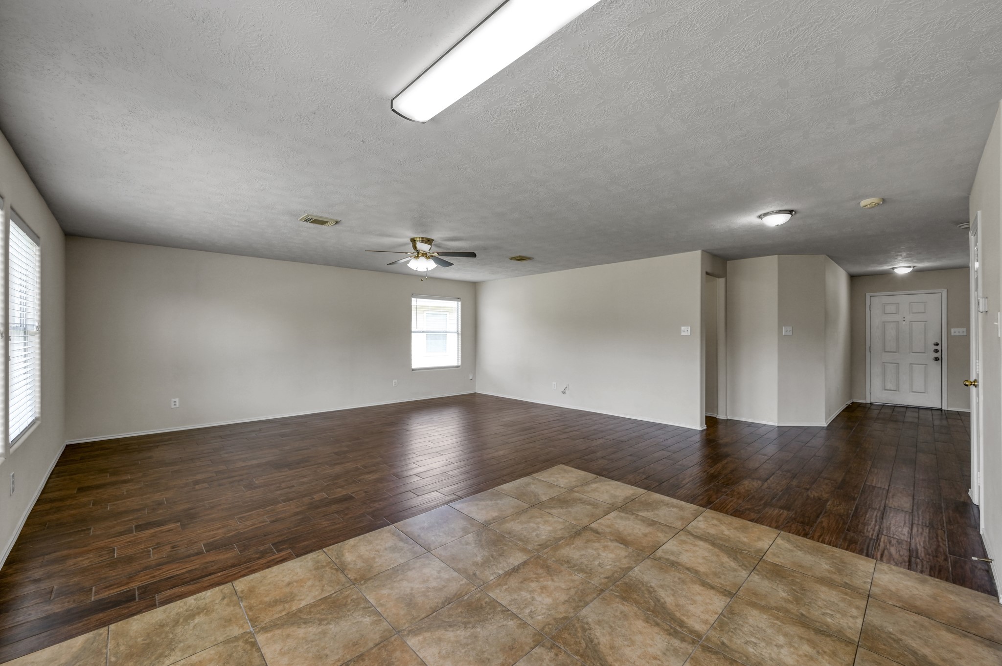 23919 Kingbriar Drive Spring, TX 77373 - Photo 11 of 33 Enjoy an open-concept design that keeps the living room connected to the kitchen and breakfast area.