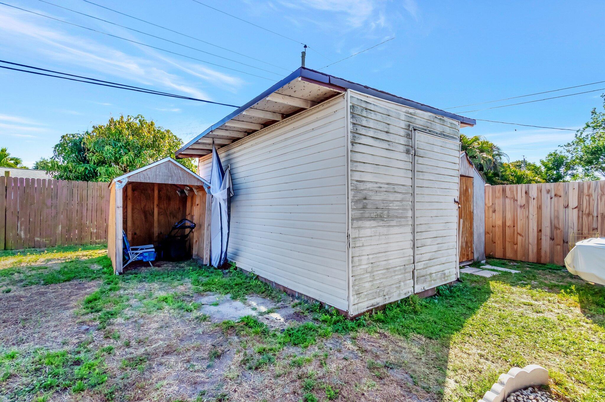 3890 Ocala Road Lake Worth, FL 33462 - Photo 28 of 29 a view of a house with backyard and wooden fence