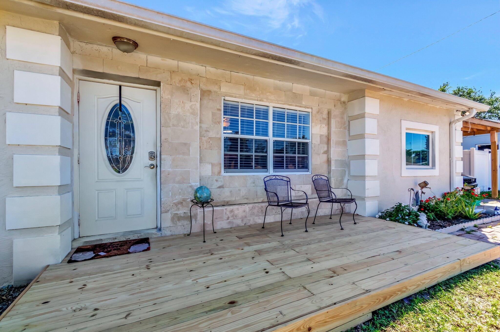 3890 Ocala Road Lake Worth, FL 33462 - Photo 6 of 29 a view of a house with backyard and sitting area