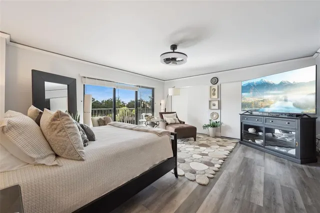 a bedroom with a bed and a couch