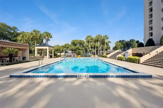 a living room with furniture a table and chairs