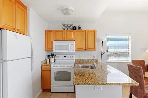 a view of a swimming pool with a table and chairs