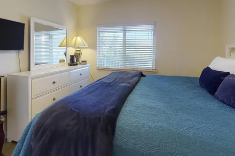 a living room with furniture a large window and a table
