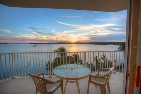 a living room with furniture and a painting on the wall