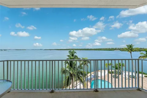 a bed room with furniture and a window