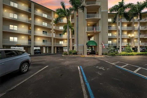 a view of a balcony next to a yard