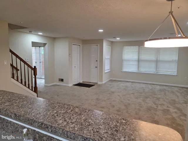 a view of an empty room and window