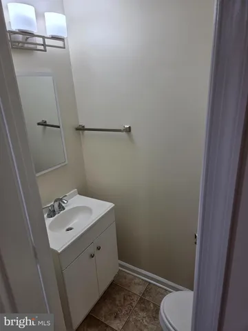 a bathroom with a sink toilet and vanity