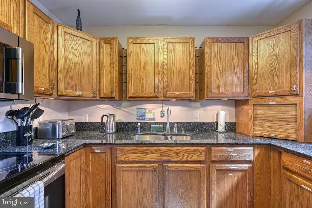 68 Emma Jane Lane Bumpass, VA 23024 - Photo 12 of 48 a kitchen with stainless steel appliances granite countertop a sink a stove and cabinets