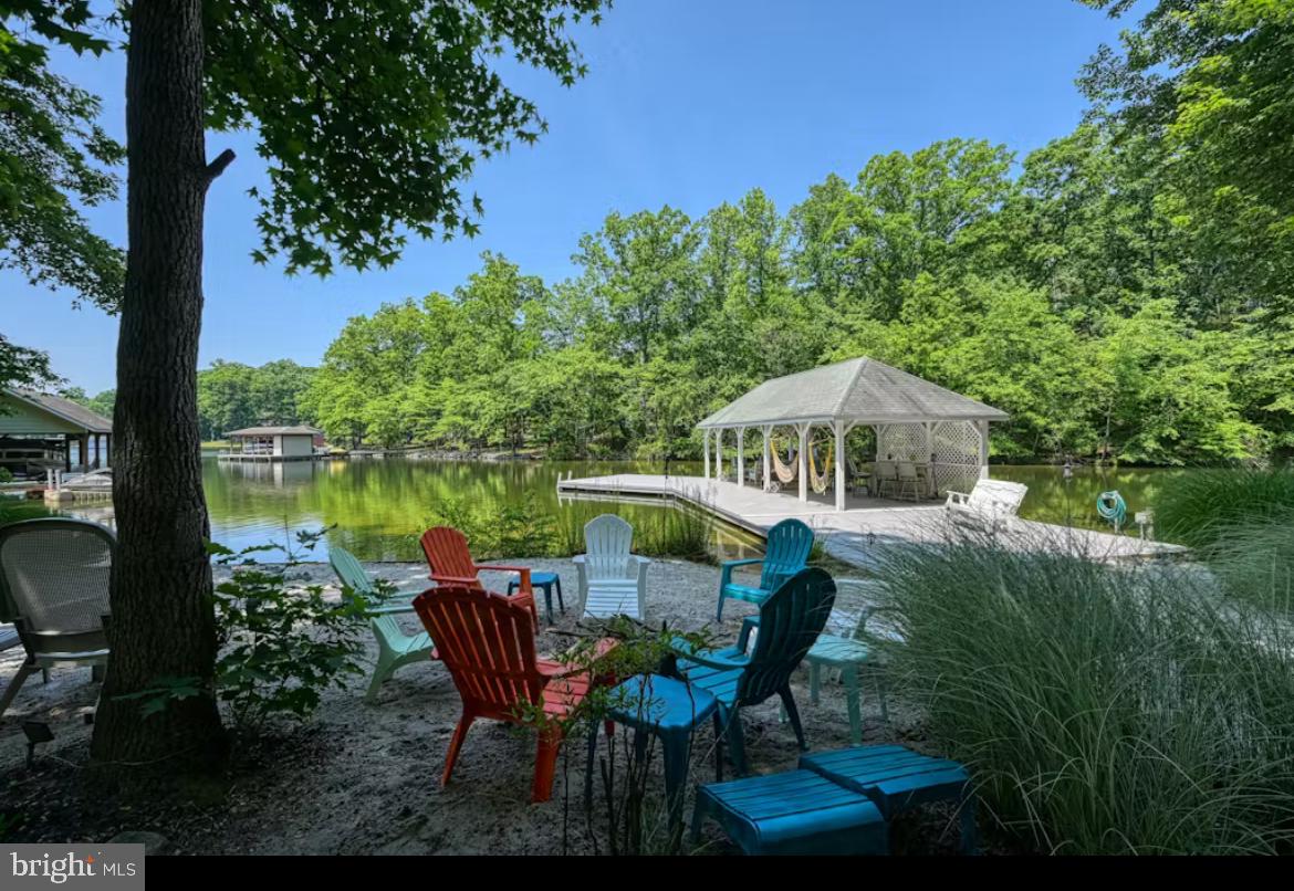 68 Emma Jane Lane Bumpass, VA 23024 - Photo 2 of 48 a view of a chairs and table in the patio next to a yard
