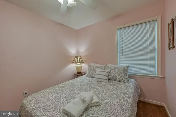 a bedroom with a bed and a lamp