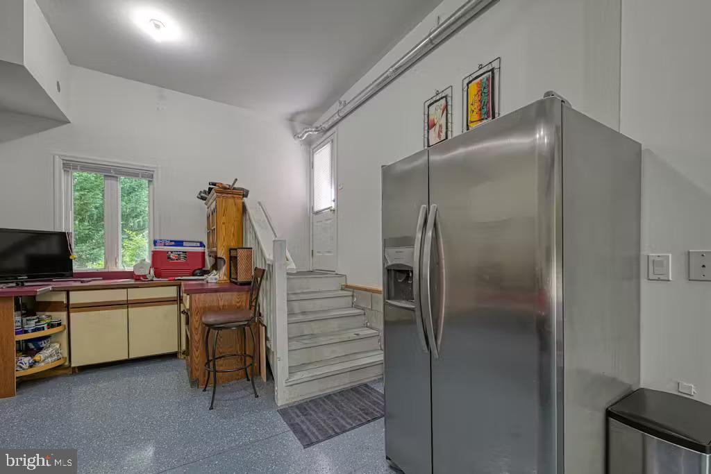 68 Emma Jane Lane Bumpass, VA 23024 - Photo 35 of 48 a kitchen that has a refrigerator and a sink