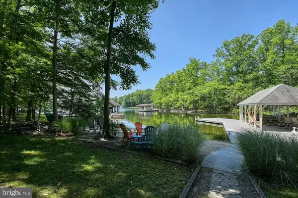 a view of a lake with a house in the background
