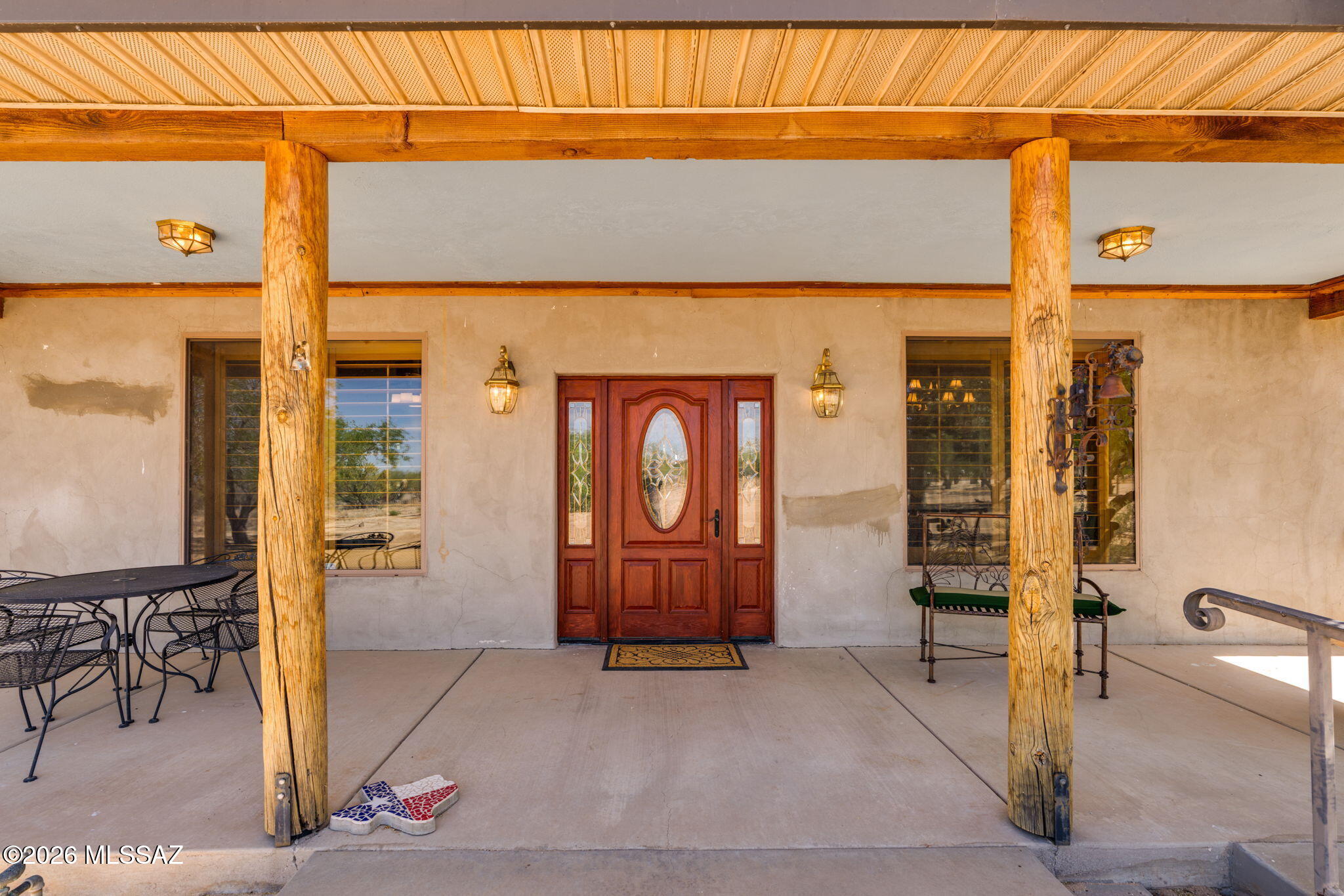 12810 West Gunsmoke Road Tucson, AZ 85736 - Photo 5 of 51 a front view of a building with glass door and door