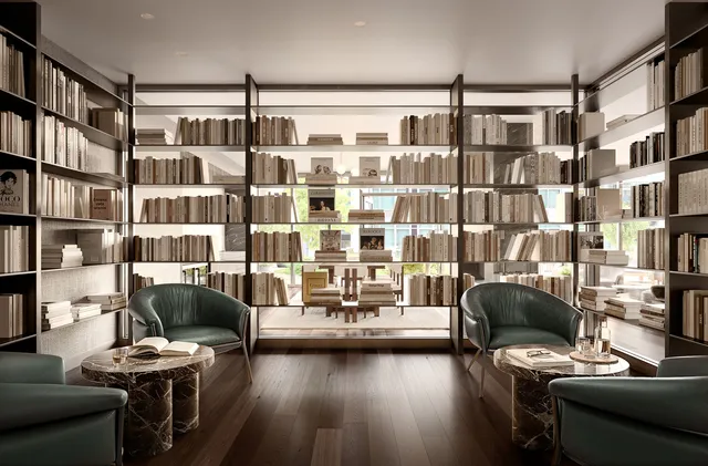 a living room with furniture and a book shelf