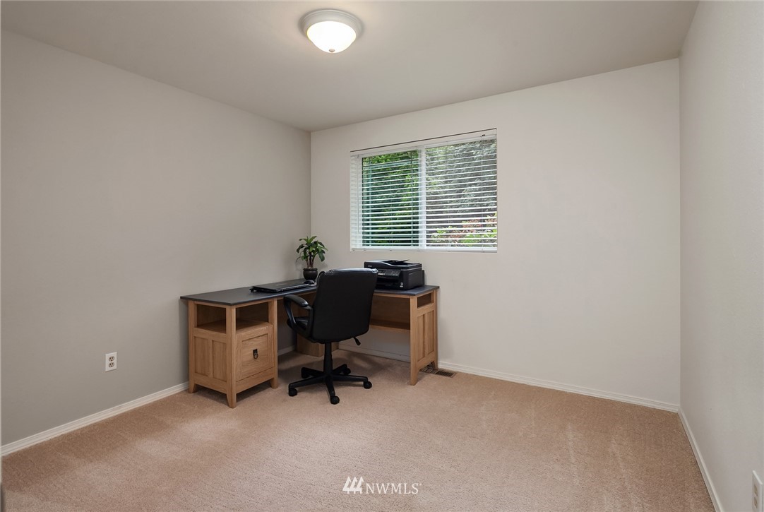 22303 49th Avenue Southeast Bothell, WA 98021 - Photo 11 of 25 a view of a workspace with furniture and a window