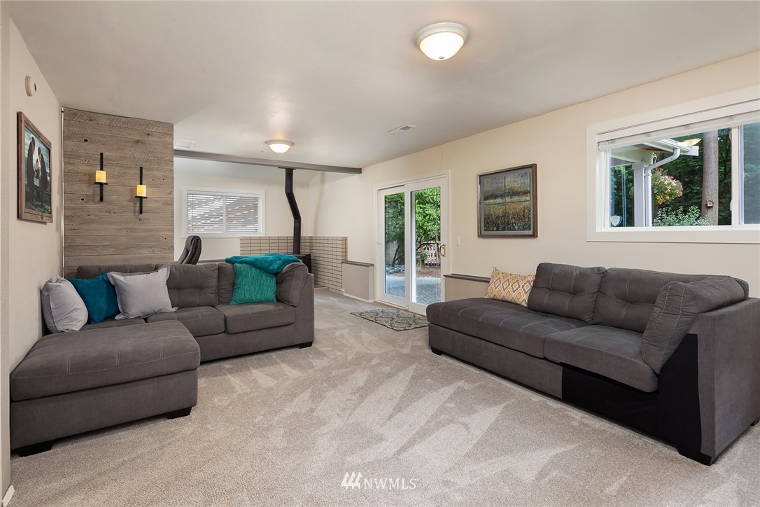 22303 49th Avenue Southeast Bothell, WA 98021 - Photo 17 of 25 a living room with furniture and a flat screen tv