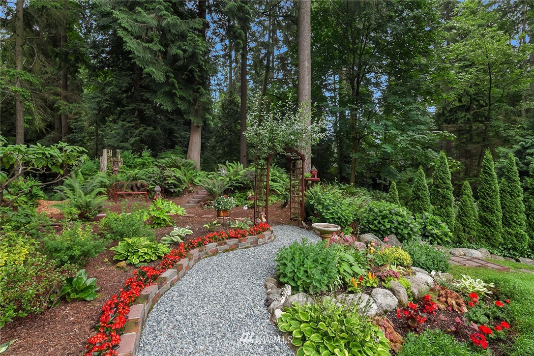 22303 49th Avenue Southeast Bothell, WA 98021 - Photo 21 of 25 a view of a garden with large trees
