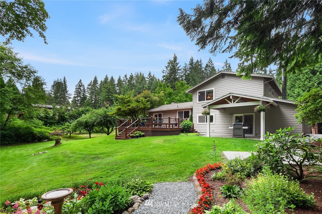 22303 49th Avenue Southeast Bothell, WA 98021 - Photo 25 of 25 a front view of a house with garden