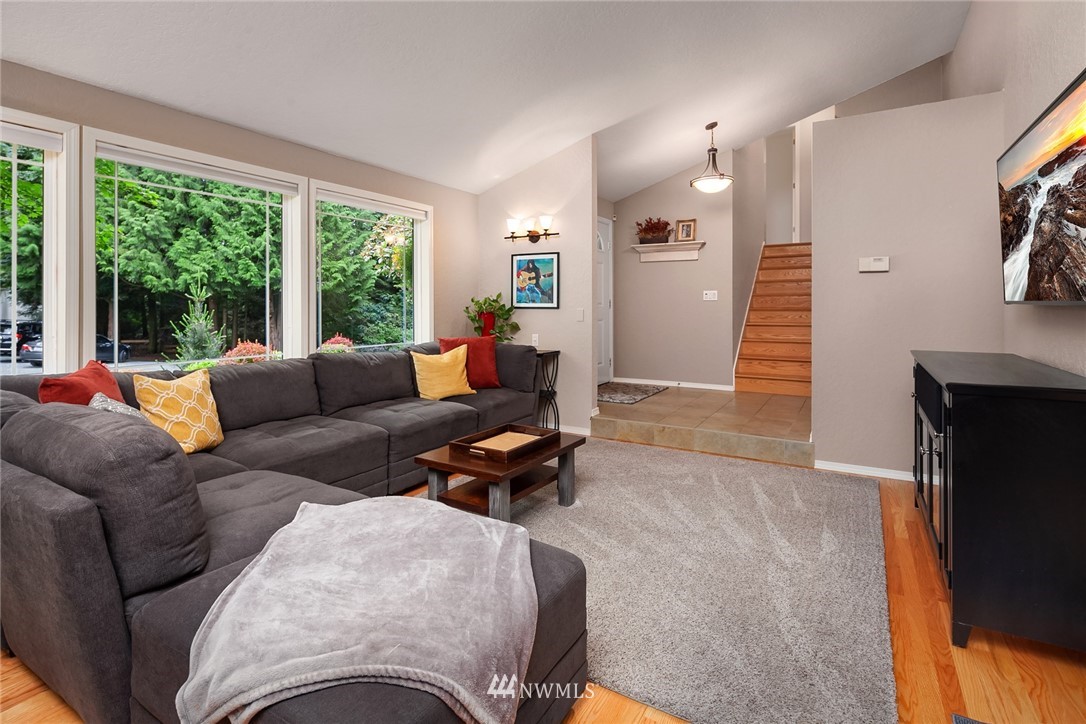 22303 49th Avenue Southeast Bothell, WA 98021 - Photo 5 of 25 a living room with furniture and a large window