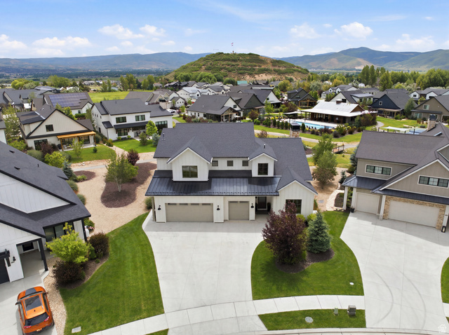 496 North Farmhouse Way, Unit 11 Midway, UT 84049 - Photo 1 of 50 Modern farmhouse-style home featuring a dark shingle roof, white siding, and black trim accents