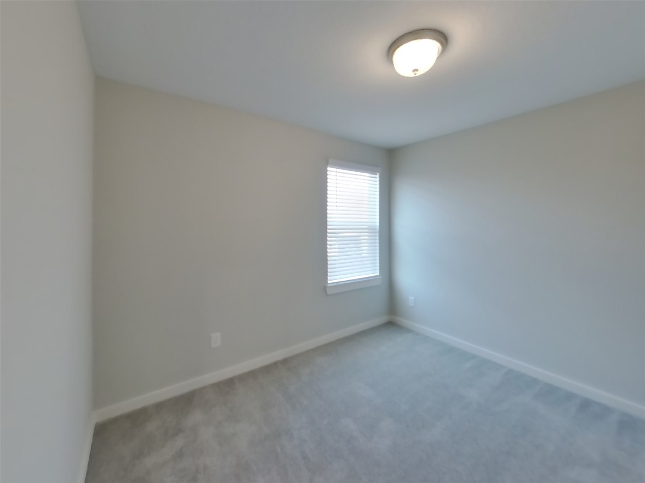 2407 Foster Hl Road Richmond, TX 77469 - Photo 12 of 24 an empty room with a window and a fan