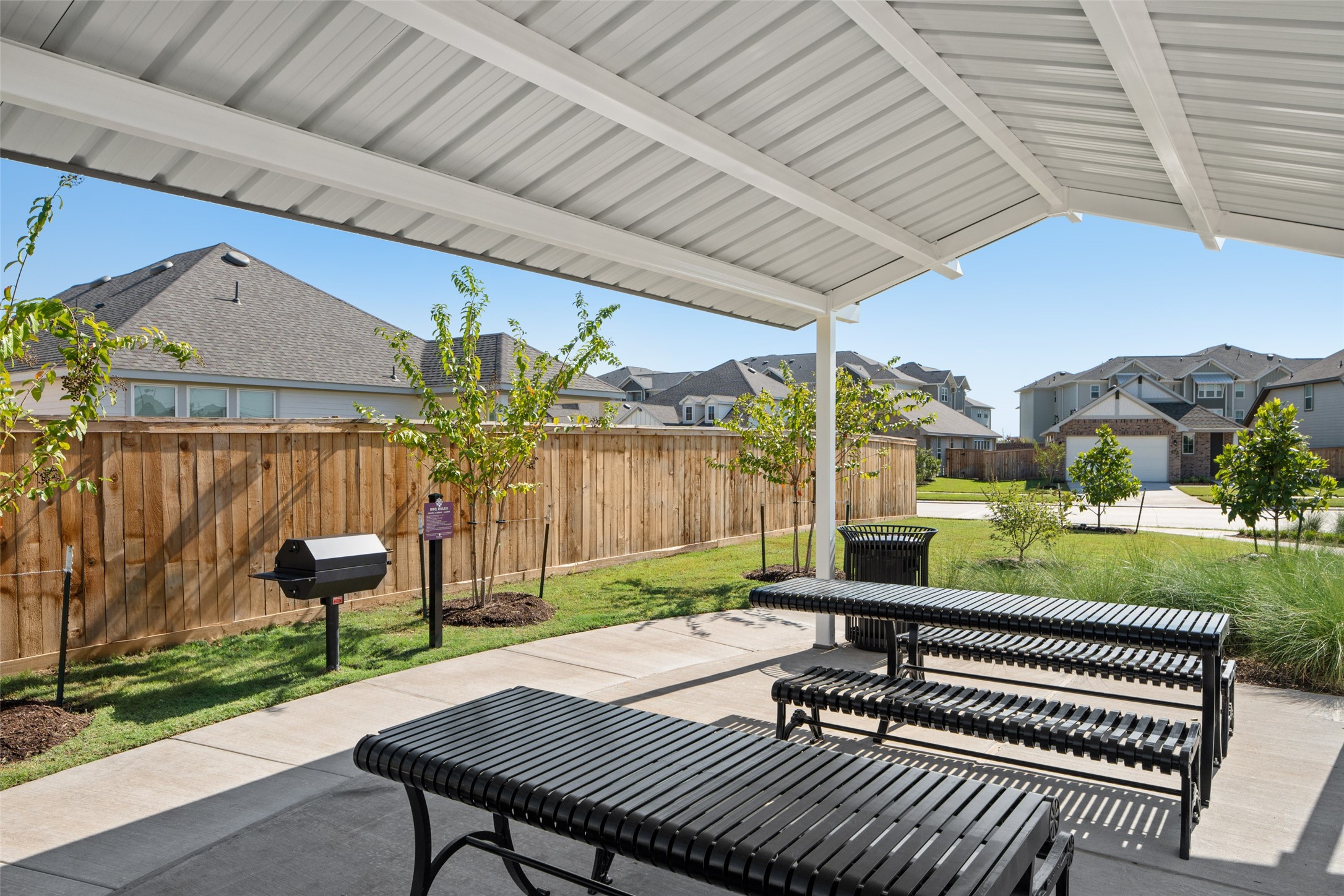2407 Foster Hl Road Richmond, TX 77469 - Photo 18 of 24 a view of a patio with table and chairs with wooden floor and fence