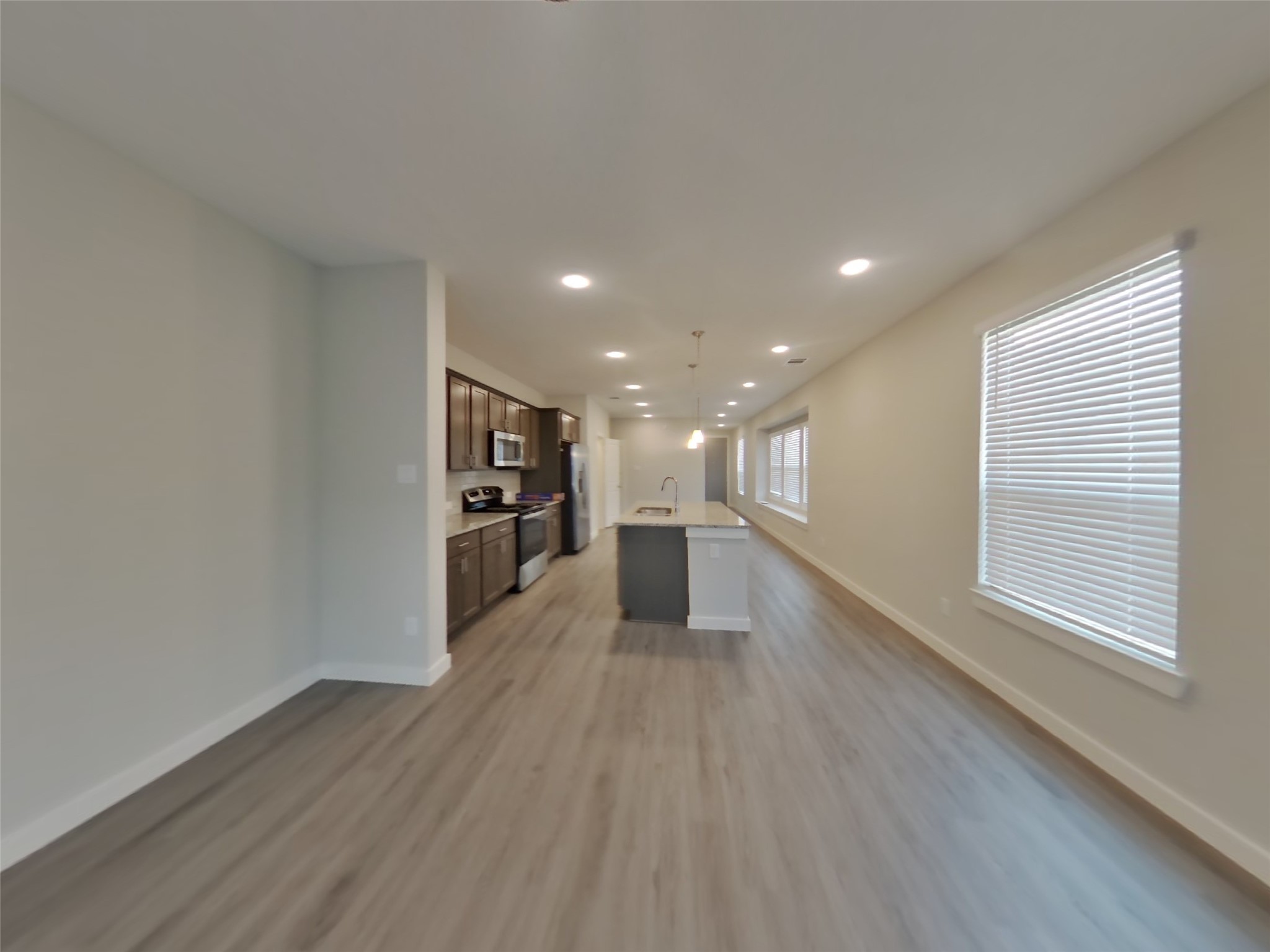 2407 Foster Hl Road Richmond, TX 77469 - Photo 3 of 24 a view of a kitchen with wooden floor