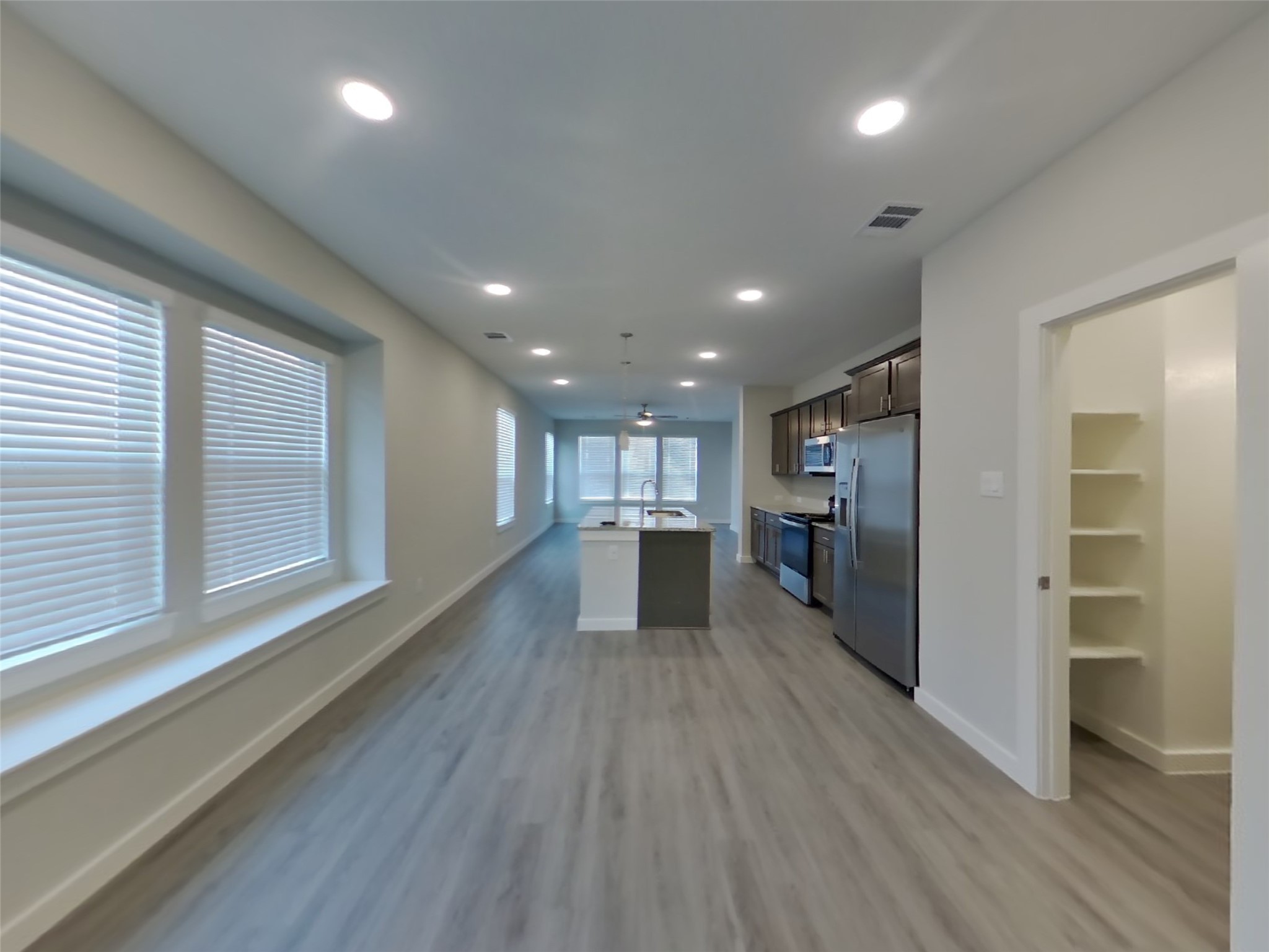 2407 Foster Hl Road Richmond, TX 77469 - Photo 4 of 24 a view of a kitchen with a sink and wooden floor
