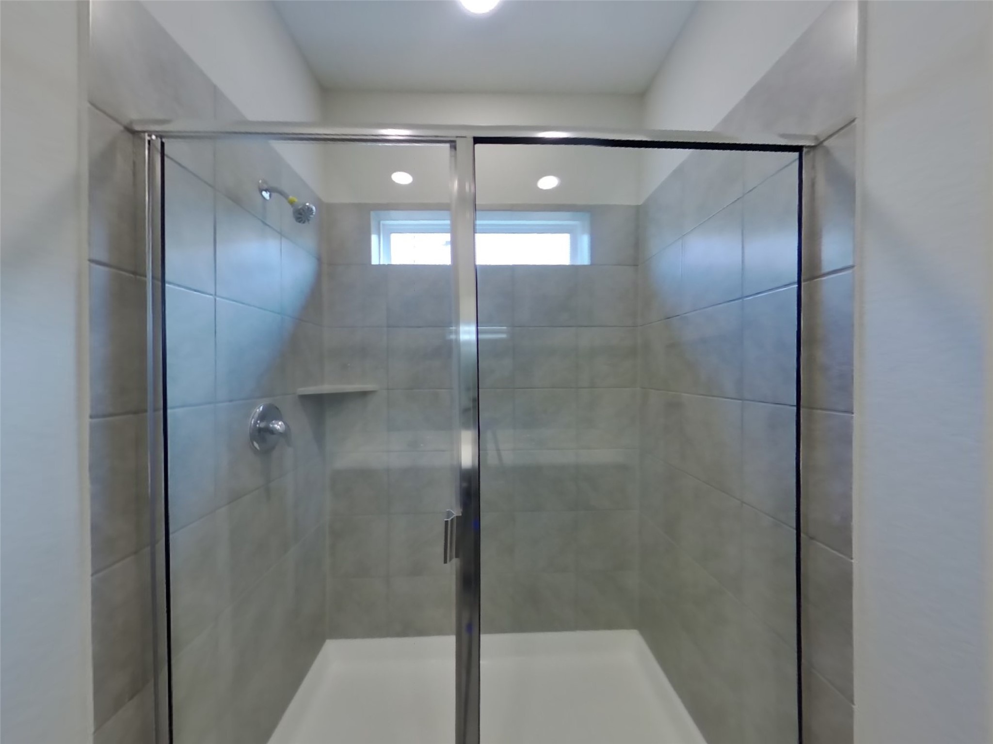 2407 Foster Hl Road Richmond, TX 77469 - Photo 9 of 24 a bathroom with a glass shower door