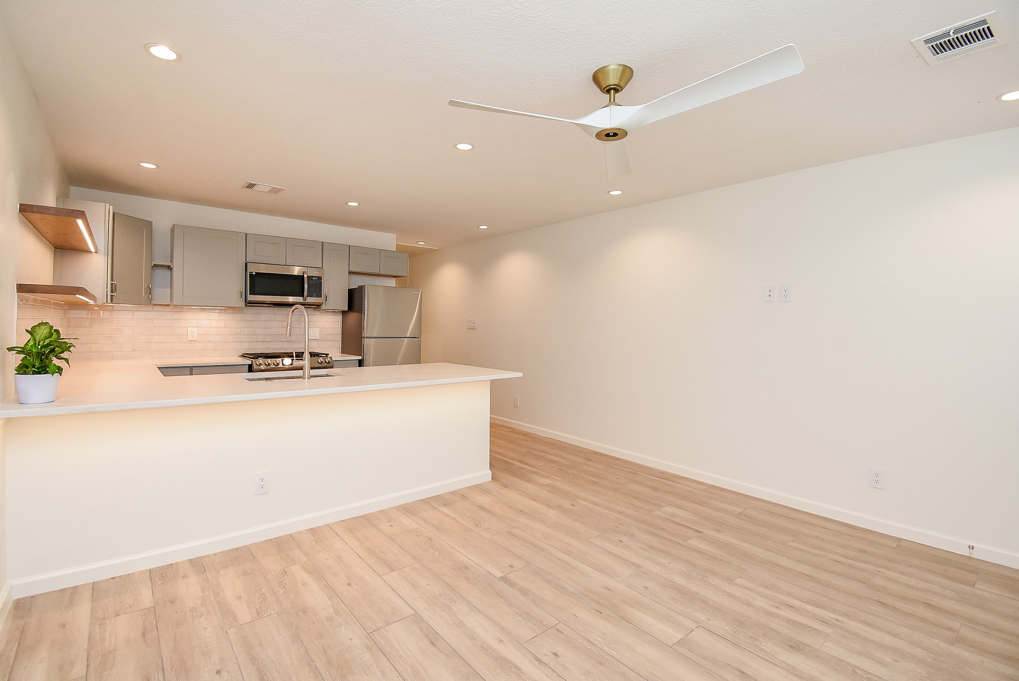 2509 Terry Street, Unit A Houston, TX 77009 - Photo 12 of 22 a view of kitchen with microwave and refrigerator