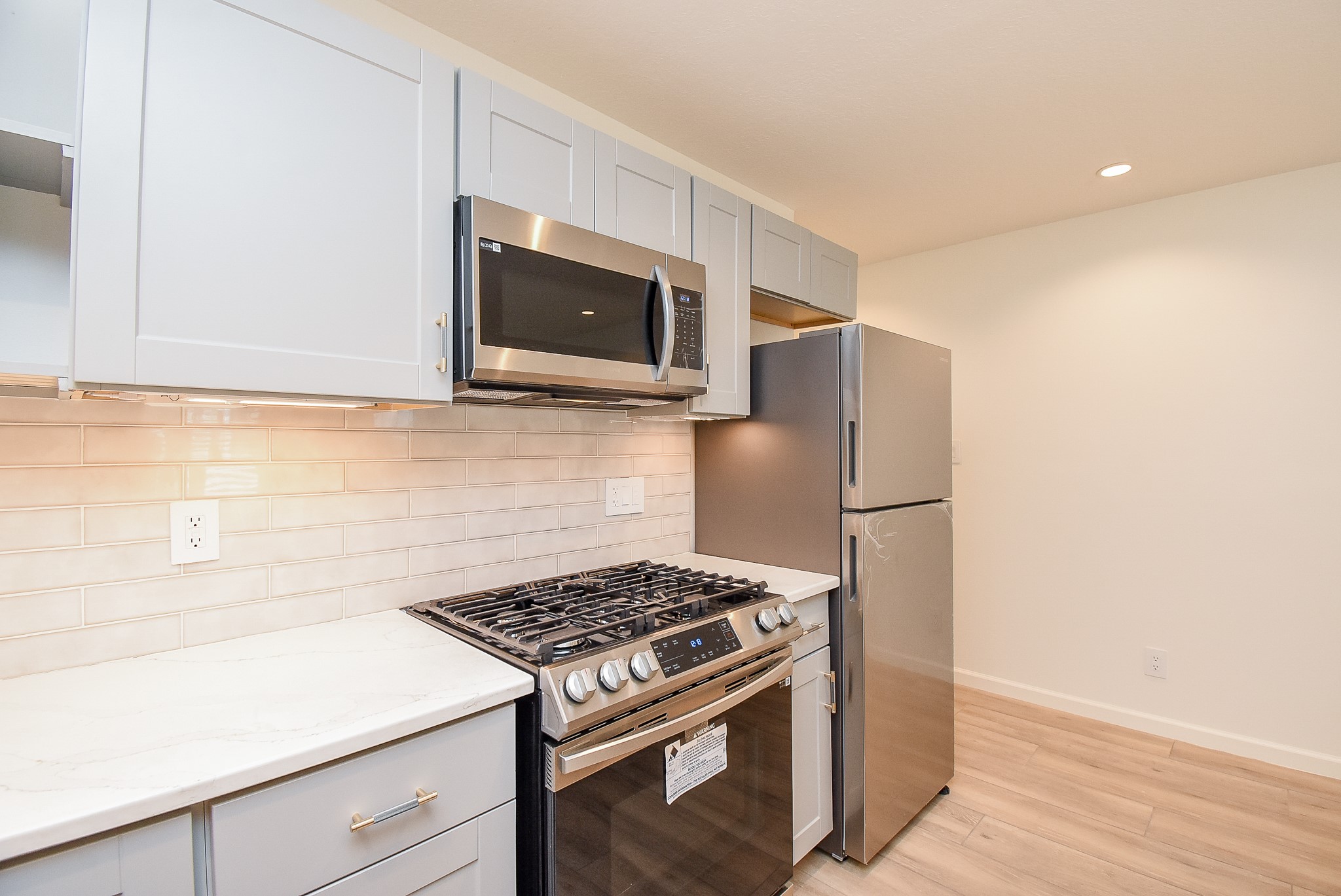 2509 Terry Street, Unit A Houston, TX 77009 - Photo 15 of 22 a kitchen with a stove and a microwave